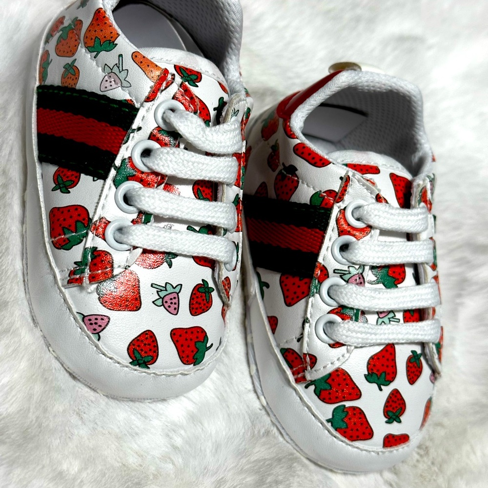 Baby, strawberry, crib shoes.